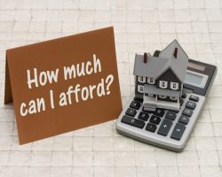 Home,Mortgage,Affordability,,A,Gray,House,,Brown,Card,And,Calculator